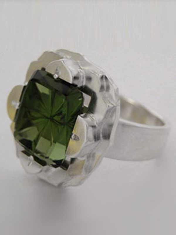 StarBrite™ cut Green Tourmaline By John Dyer & Co.  In a custom Silver ring designed and made by Andy Lucas.